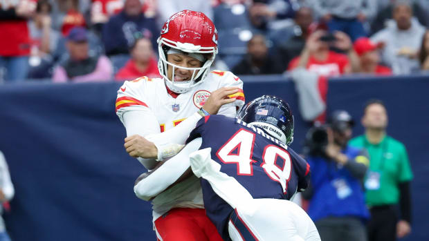 Dec 18, 2022; Houston, Texas, USA; Houston Texans linebacker Christian Harris (48) hits Kansas City Chiefs quarterback Patrick Mahomes (15) during the second quarter at NRG Stadium. Mandatory Credit: Kevin Jairaj-USA TODAY Sports